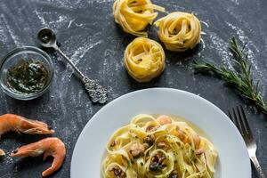 Tagliatelle pasta with seafood photo