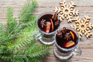 Two glasses of mulled wine with fir branch photo