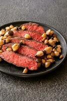 Steak rib eye with mushrooms photo