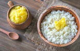 Bowls of rice and Ghee clarified butter photo