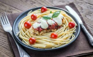 Baked chicken with parmesan and mozzarella photo