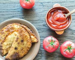 Meat Patties on the wooden background photo