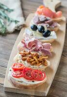 Crostini with different toppings photo