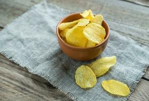 Potato chips in the glass bowl photo