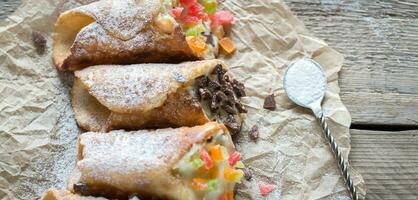 Cannoli stuffed with cream cheese photo