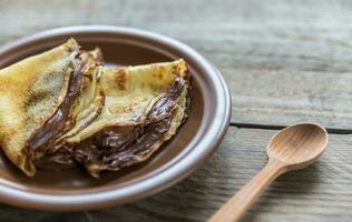 Crepes with chocolate cream photo