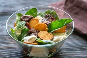 Salad with sun-dried tomatoes photo