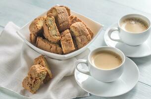 Two cups of coffee with cantuccini photo