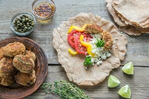 Appetizer with falafel, cottage cheese and vegetables photo