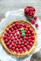 Raspberry tart with custard photo