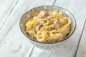 Bowl Alfredo pasta with mushrooms photo