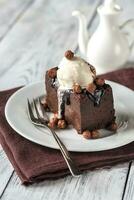 Chocolate brownie with vanilla ice cream photo