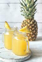 Two glasses of pineapple juice photo