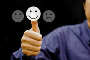 Businessman give rating satisfaction using thumbs up. Evaluate quality of service and feedback survey concept. photo