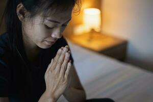 Hands folded in prayer concept for faith, Religious young woman praying to God in the morning, spirtuality and religion, Religious concepts. photo