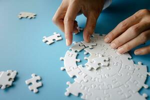 Closeup hand of woman connecting jigsaw puzzle, Business solutions, success and strategy concept photo