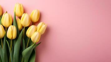 AI generated Bouquet yellow tulips on pastel pink background with copy space. Spring flowers minimal composition. Greeting card for Mothers or Women's day photo