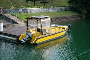 Singapore - September 7 2023 Yellow Patrol Boat at Platform photo