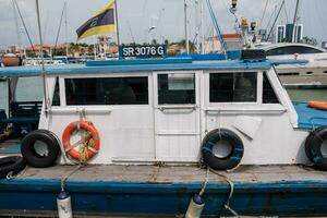 Vintage Boat Anchored in Bay photo