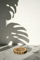 Wooden cut podium with monstera leaf shadow for natural cosmetics or products presentation photo