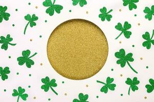 Shiny St. Patricks Day background. Golden round hole and shiny green shamrocks pattern. Happy St.Patricks Day background photo