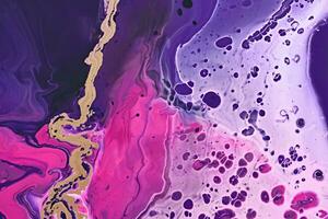 Fluid Art. Metallic gold abstraction and bubbles on purple waves. Marble effect background or texture photo