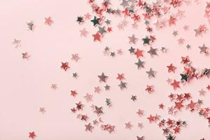 Pink and gray pastel Stars Glitter Confetti on pink background. Festive backdrop. photo