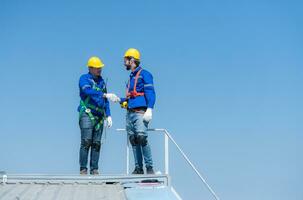 Both of technician working on a photovoltaic solar panels photo