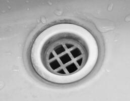 Old home sink hole closeup photo