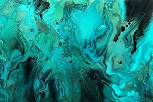 Fluid Art. Green and blue abstract wave swirls on black background. Marble effect background or texture photo