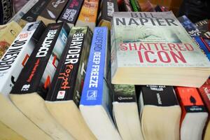 New Delhi, India, September 09 2023 - Variety of Books on shelf inside a book-stall at Delhi International Book Fair, Selection of books on display in Annual Book Fair. photo