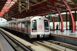 New Delhi India - October 09 2023 - Delhi Metro train arriving at Jhandewalan metro station in New Delhi, India, Asia, Public Metro departing from Jhandewalan station photo