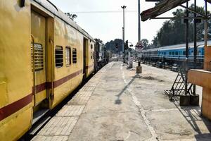 Kathgodam, Uttarakhand, India, September 25 2023 - Indian railway train at Kathgodam railway station platform during morning time, Colourful train at Kathgodam, Uttarakhand railway station photo