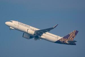 New Delhi, India, April 16 2023 - Vistara Airbus A320 neo take off from Indra Gandhi International Airport Delhi, Vistara domestic aeroplane flying in the blue sky during day time photo