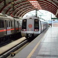 New Delhi India - October 09 2023 - Delhi Metro train arriving at Jhandewalan metro station in New Delhi, India, Asia, Public Metro departing from Jhandewalan station photo