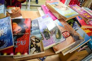 New Delhi, India, September 09 2023 - Variety of Books on shelf inside a book-stall at Delhi International Book Fair, Selection of books on display in Annual Book Fair. photo