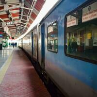 Kathgodam, Uttarakhand, India, September 25 2023 - Indian railway train at Kathgodam railway station platform during morning time, Colourful train at Kathgodam, Uttarakhand railway station photo