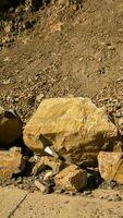 AI generated Geology Hammer and Boulder on Rocky Terrain photo