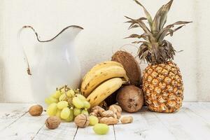 mixed with autumn fruits and a pitcher photo