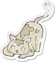 retro distressed sticker of a cartoon cat playing png