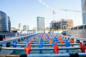 soccer table for multi players in the construction zone skyscrapers photo