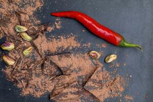 red chili peppers and dark chocolate pieces photo