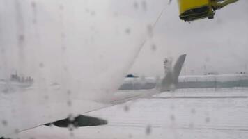 Prepare airplane for departure. Deicing. video