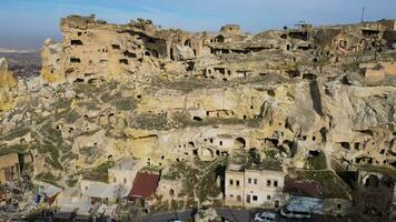 Aerial drone view the old troglodyte settlement of Cavusin, in Cappadocia, Turkey. This location is part of the Goreme National Park and the Rock Sites of Cappadocia inscribed as a Unesco site. video