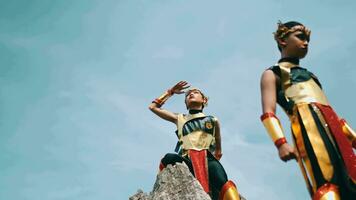 a group of golden warriors was standing on a rock cliff to monitor the enemy from far away video