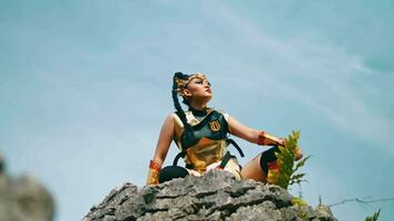 a group of golden warriors was standing on a rock cliff to monitor the enemy from far away video