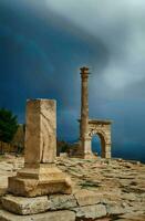 Column and arches of ancient Roman agora photo