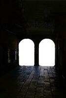 Silhouette of tourists in an arcade photo
