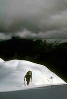 Climber ascending snowfield photo