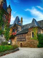 Fall colors on Reichsburg Castle  at Cochem, Germany photo